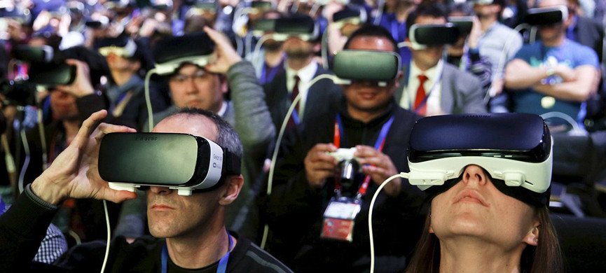 People wear Samsung Gear VR devices as they attend the launching ceremony of the new Samsung S7 and S7 edge smartphones during the Mobile World Congress in Barcelona, Spain, February 21, 2016. REUTERS/Albert Gea TPX IMAGES OF THE DAY