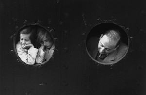 <p>17th June 1939: German Jewish refugees, looking through portholes aboard the Hamburg-Amerika liner 'St Louis' on arrival at Antwerp, where a temporary home was found for the 900 refugees aboard. Most were later deported. (Photo by Gerry Cranham/Fox Photos/Getty Images)</p>