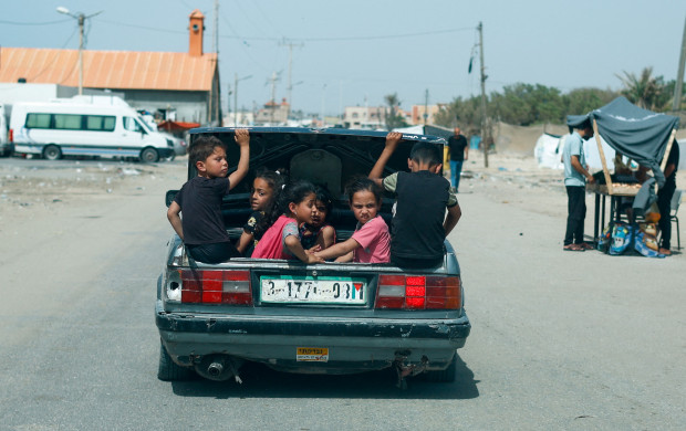 <p>Children sit in a car trunk, amid the ongoing conflict between Israel and Hamas, in Rafah, in the southern Gaza Strip, April 24, 2024. REUTERS/Mohammed Salem</p>