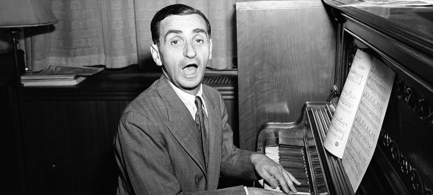<p>"Be Careful, It's My Heart," is the song Irving Berlin sings during an interview in Berlin's New York office, July 16, 1942. Besides appearing in the army relief show, "This Is The Army" which he wrote and produced, the noted composer has written several new songs for a movie. (AP Photo/Murray Becker)</p>