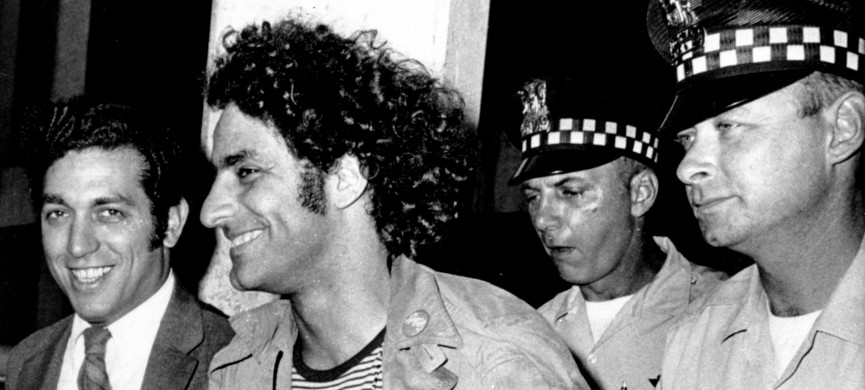 <p>Abbie Hoffman, leader of the Youth International Party known as the Yippies, is escorted by police after his arrest at O'Hare Field in Chicago upon his arrival from New York on Sept. 17, 1968. He was sought for not appearing in court on Sept. 6 to answer charges of disorderly conduct and resisting arrest. Police said a switchblade knife and a knife with a four-inch blade was found on Hoffman, who was then booked on charges of unlawful use of weapon. At left is his attorney Gerald B. Lafcourt. (AP Photo)</p>