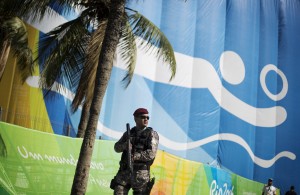 <p>A National Security Force officer patrols outside the beach volleyball arena along Copacabana Beach ahead of the upcoming 2016 Summer Olympics in Rio de Janeiro, Brazil, Tuesday, Aug. 2, 2016. (AP Photo/David Goldman)</p>