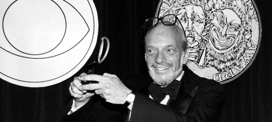 <p>Harold Prince poses with his Tony Award for best direction of a musical in 1980. He earned the honor for his work on <em>Evita.</em></p>
