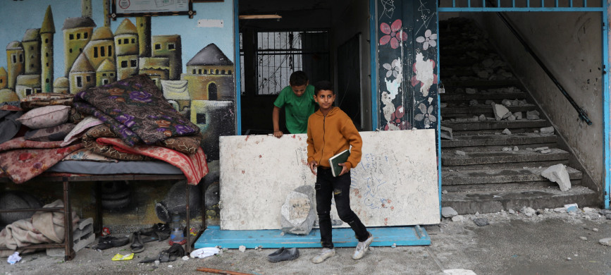 <p>Palestinians inspect the site of an Israeli strike on a UNRWA school sheltering displaced people, amid the Israel-Hamas conflict, in Nuseirat refugee camp in the central Gaza Strip, June 6, 2024. REUTERS/Abed Khaled</p>