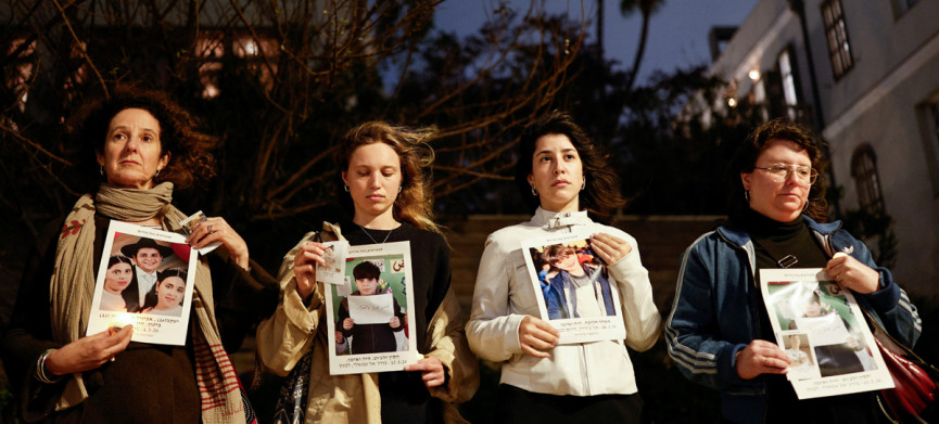 <p>Activists stand with pictures of children killed in Israel, Palestine, Iran and Lebanon, in a silent vigil calling for an end to the ongoing U.S.-Israeli conflict with Iran, in Tel Aviv, Israel, March 19, 2026. REUTERS/Amir Cohen</p>
